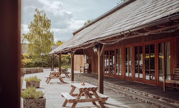 Picnic benches outside in the front courtyard area